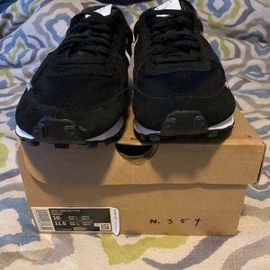 Nike black with white stripe mesh top and sides